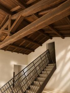 a staircase in a building with wooden beams at Alnus in Valentano