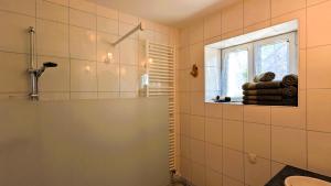 a bathroom with a sink and a window at Les Chambres de Grangette in Thury +21 photos