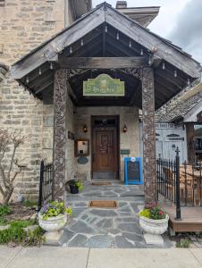 a entrance to a building with a sign on it at The Breadalbane Inn in Fergus