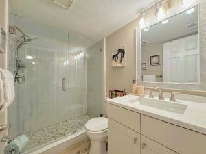a bathroom with a toilet and a shower and a sink at Vacation Villas #432 - Beachfront Condo in Fort Myers Beach