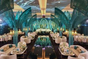 a banquet hall with tables and chairs and a pool at JW Marriott Hotel Muscat in Muscat +137 photos