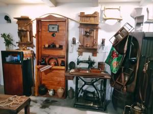 a room filled with lots of wooden items on a wall at Etno kuća Teodora in Staji°evo