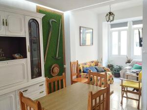a kitchen and living room with a table and chairs at Eco Mar - Cedeira in Cedeira