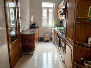 a kitchen with a sink and a stove top oven at Eco Mar - Cedeira in Cedeira