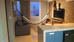 a living room with a hammock in a room at Apartamento ao lado do Mercado Central Edifício Fidelis in Goiânia