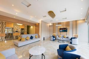 a living room with couches and a table at AlQasr - Almansak in Abha