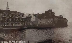 an old black and white photo of a building in the water at Medin BD in Budva +6 photos
