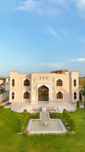 a large building with a fountain in the yard at Hamzas production in Islamabad