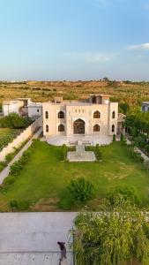 an aerial view of a house with a yard at Hamzas production in Islamabad