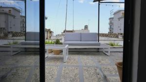 two chairs and a coffee table on a patio at Casa Fidelia in Ceglie Messapica