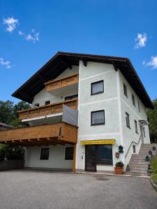 a large white building with a lot of windows at Ferienwohnung Bergpanorama Waldweg in Altmünster