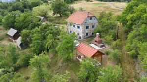 an aerial view of a house on a hill at Etno kuća Krvavac in Pljevlja