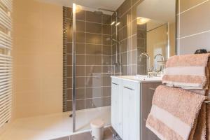 a bathroom with a shower and a tub and a sink at Le Moulin de Commagny in Moulins-Engilbert +29 photos