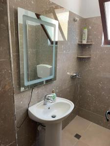 a bathroom with a sink and a mirror at Besart Room in Orikum