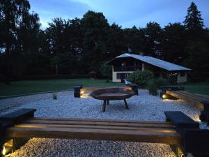 a park with a table and benches and a pavilion at Kopitnik cosy cabin in Dol pri Hrastniku