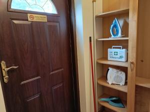 a wooden door with a box in a room at Apartament Orłowo in Gdynia