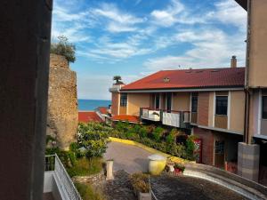 a view of a building with the ocean in the background at Bigò Apartments in Termoli
