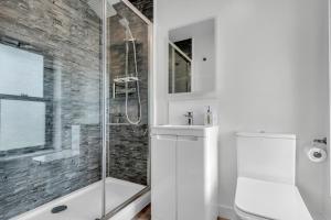 a bathroom with a shower and a toilet and a sink at Larkey View A Tranquil Space For Two - Pass the Keys in Canterbury