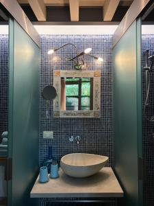 a bathroom with a sink and a mirror at La Casetta del Lago in Lovere +49 photos