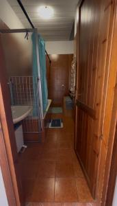 a bathroom with a toilet and a sink in a room at Villa Gina in Villar Pellice +2 photos