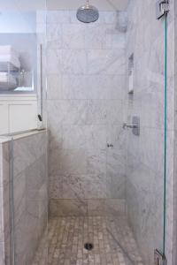 a shower with a glass door in a bathroom at Playa One Bedroom (251) in Carpinteria