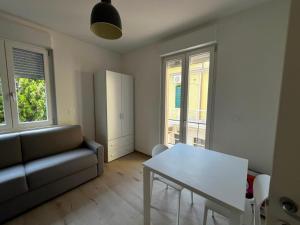 a living room with a couch and a table at Bigò Apartments in Termoli +6 photos