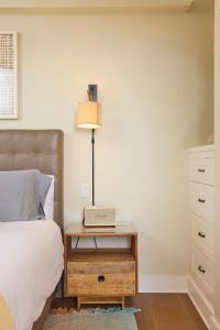 a bedroom with a bed and a lamp on a night stand at Playa One Bedroom (253) in Carpinteria