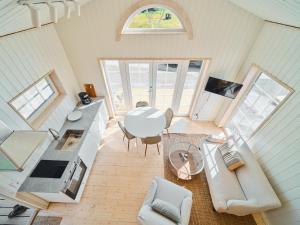 an overhead view of a living room with a table at Lakeside Herrestad in Värnamo
