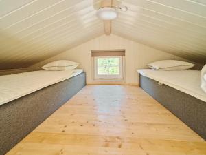 a room with two bunk beds and a window at Lakeside Herrestad in Värnamo