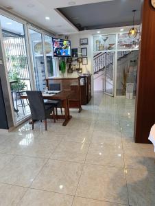 a dining room with a table and chairs and a television at Motel Liberta in Jajce +52 photos
