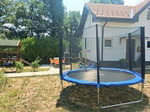 a trampoline in the yard of a house at New Modern Duplex with Free Parking in Prijepolje