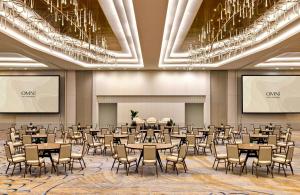 a conference room with tables and chairs and chandeliers at Omni Fort Lauderdale Hotel in Fort Lauderdale +126 photos
