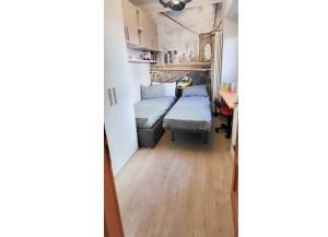 a small room with a bed and a mirror at Casa Vacanza da Nicolo by Lago Reisen in Pallanza +10 photos