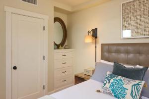 a bedroom with a bed and a mirror at Playa One Bedroom (255) in Carpinteria +3 photos