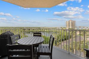 a table and chairs on a balcony with a view at Lovers Key #508 by Sun Palace Vacations in Fort Myers Beach