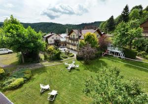 an aerial view of a yard with a house at Pensjonat Fluder in Jaszczurowa