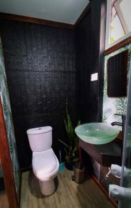 a bathroom with a toilet and a sink at Espacio modular privado in Coquimbo