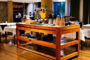 a table with food on it in a restaurant at Esplendor by Wyndham El Calafate in El Calafate