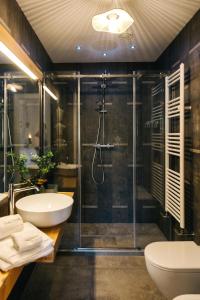 a bathroom with a shower and a sink and a toilet at Appartamento Sea - Tenuta Fascianello in Fasano +31 photos
