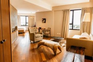 a living room with a couch and a table at Esplendor by Wyndham El Calafate in El Calafate +69 photos