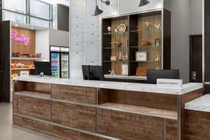 a lobby of a store with a reception desk at Four Points by Sheraton New York Downtown in New York