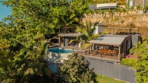 an aerial view of a house with a swimming pool at Villa Palacio Verde Las terrenas in Las Terrenas