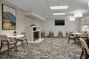 a conference room with tables and chairs and a screen at Residence Inn by Marriott Provo North University in Provo +32 photos