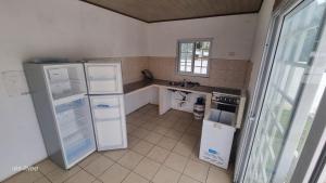 a kitchen with two refrigerators and a sink at Casa Troya in Nueva Gorgona