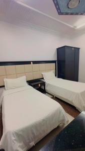 a hotel room with two beds in a room at السلطان هاوس in Najran
