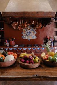 three bowls of fruit sitting on a table at Hacienda Las Amantes in San Miguel de Allende