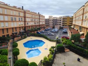 an overhead view of a pool in a parking lot at Duplex Beach Cabezo 2h terrace in El Médano