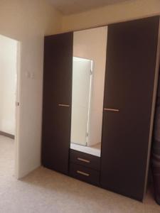a large black cabinet with a mirror in a room at Dar Al Medina in Casablanca