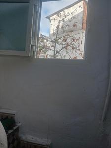 a window in a room with a tree outside at Dar Al Medina in Casablanca