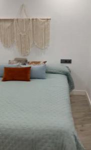 a bedroom with a large bed with a window at Apartamento Hércules in Ceuta